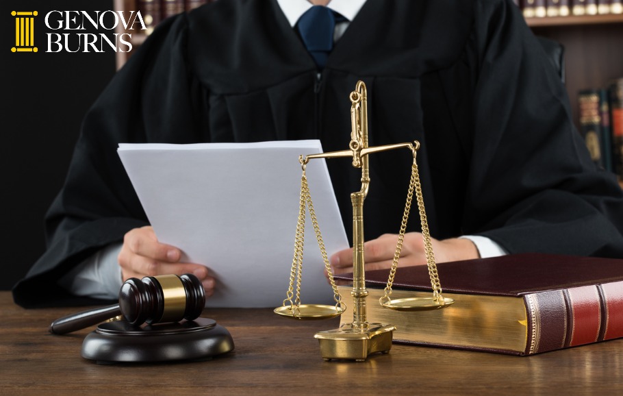 Judge reading documents at desk in courtroom 